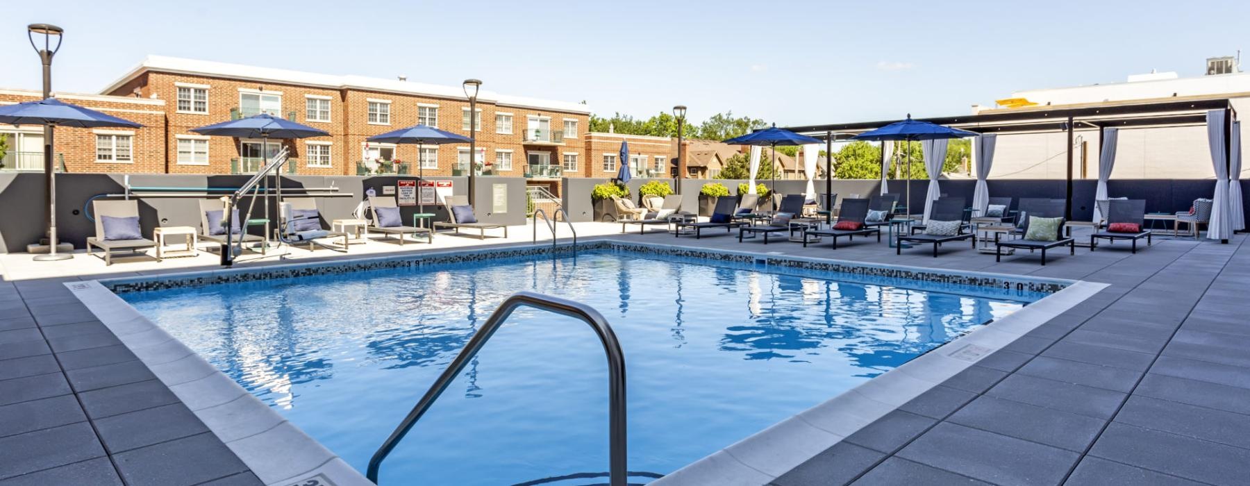 a swimming pool with a building in the background