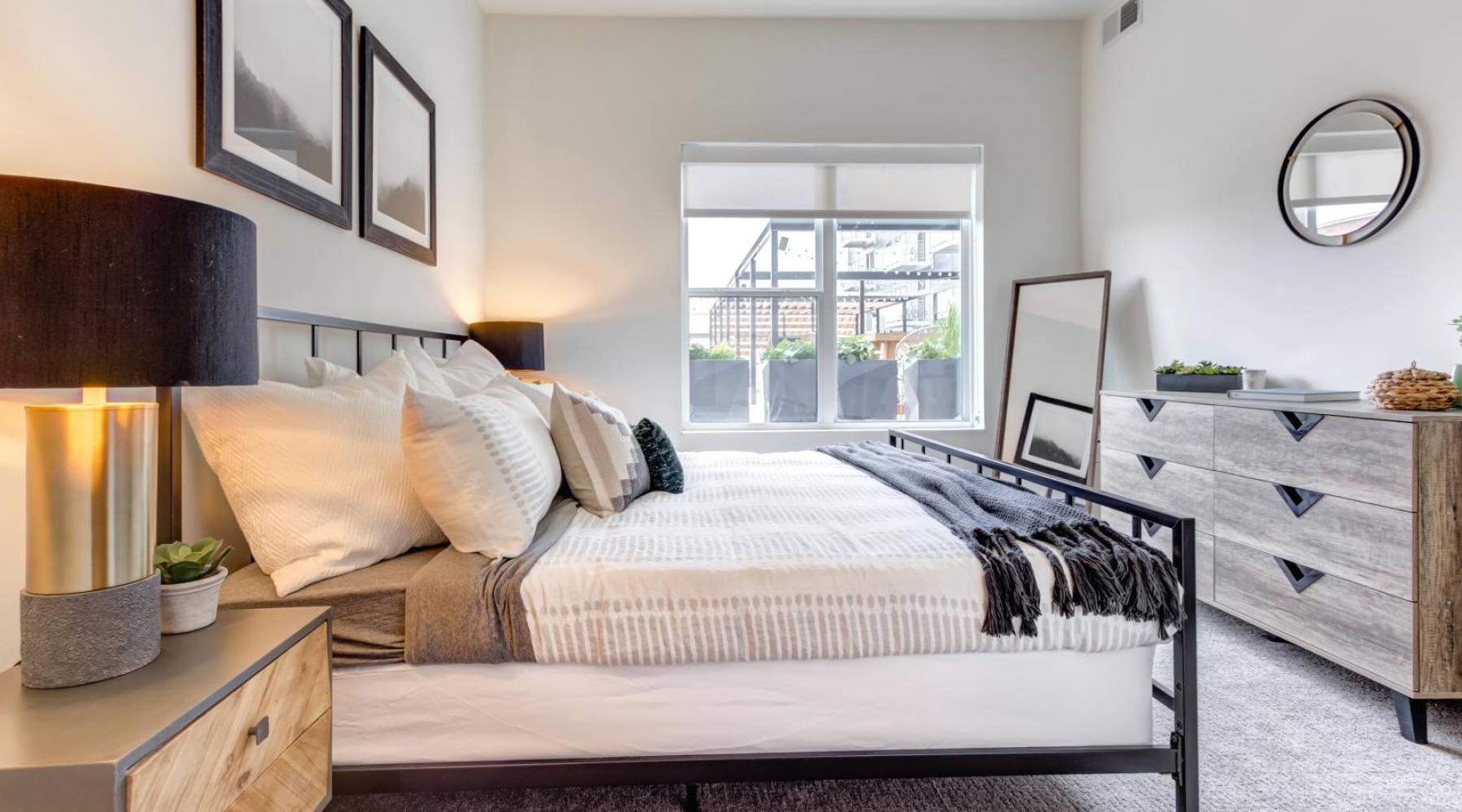 a bedroom with a bed and a mirror