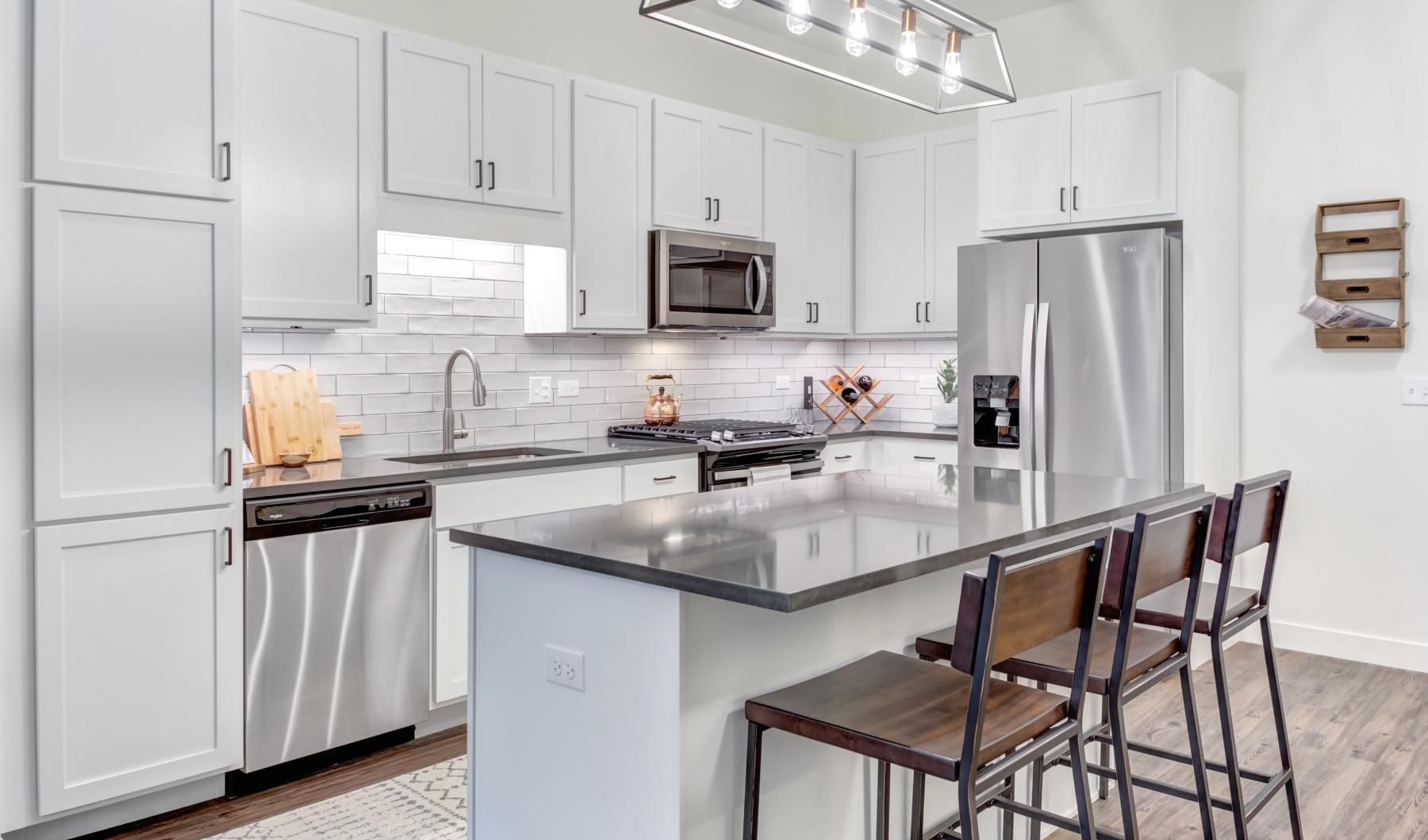 a kitchen with white cabinets