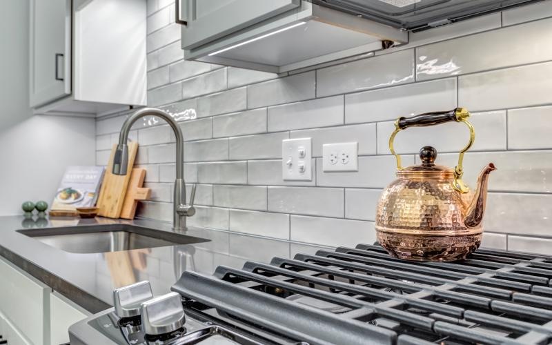a kitchen with a tea kettle on the stove
