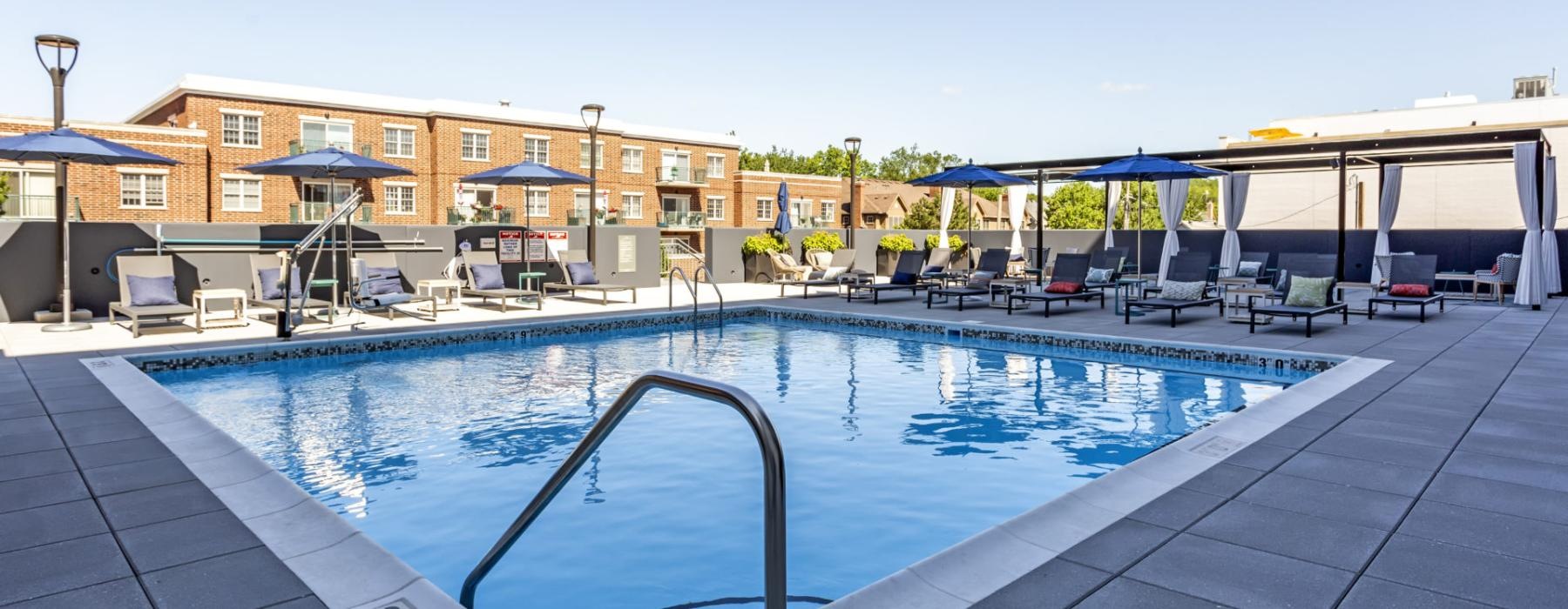 a swimming pool with a building in the background